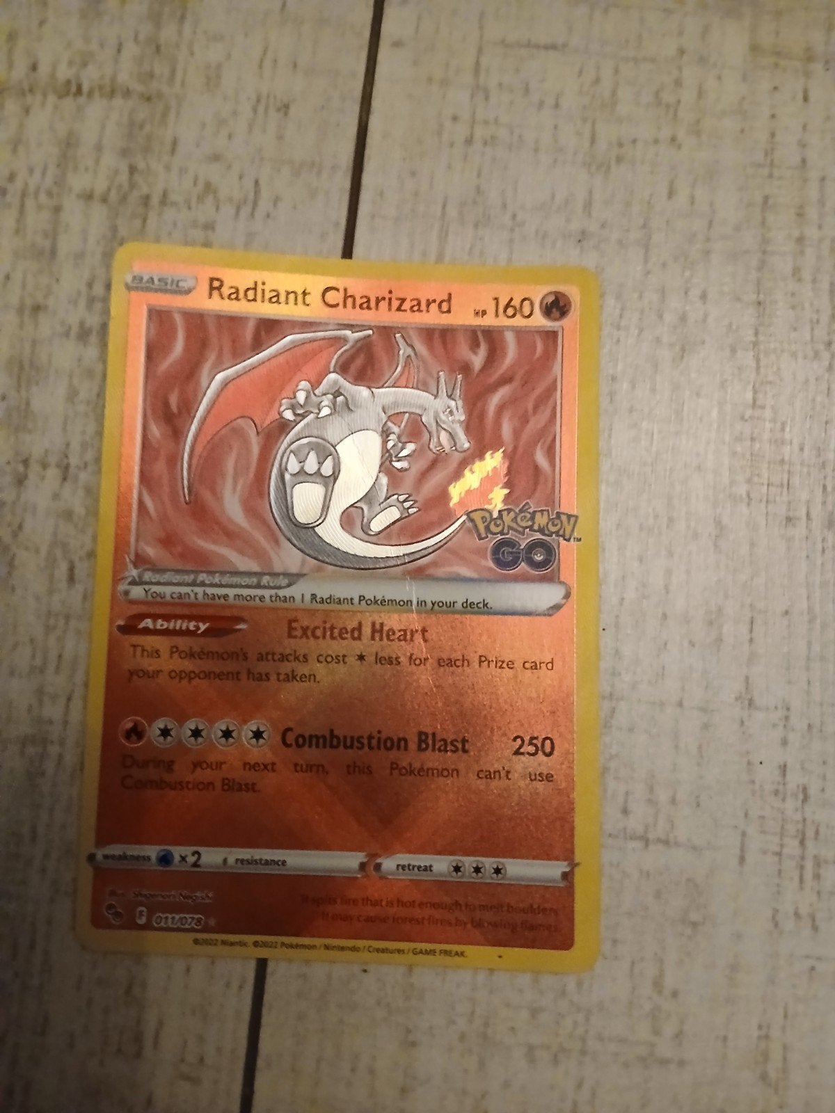 radiant charizard, Ophalen of Verzenden, Nieuw, Losse kaart