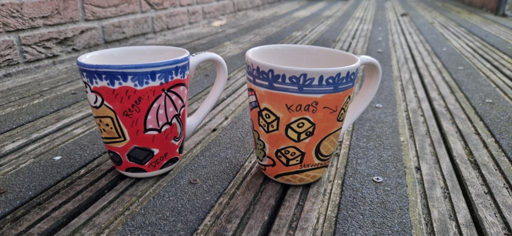 Twee mokken Blond Amsterdam zgan Learning Dutch, Ophalen of Verzenden, Zo goed als nieuw, Aardewerk, Kop(pen) en/of Schotel(s)