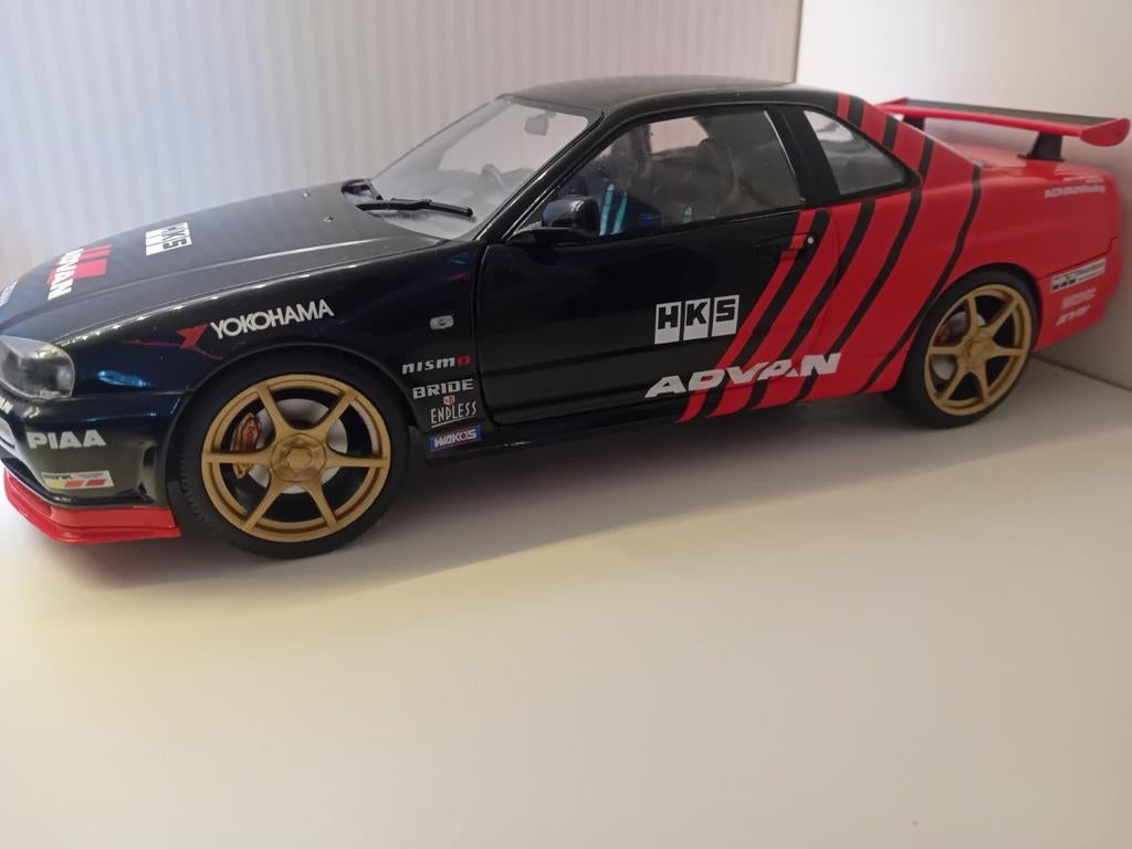 Nissan Skyline GT-R R34 HKS Advan modelauto 1:18, Hobby en Vrije tijd, Modelauto's | 1:18, Ophalen of Verzenden, Gebruikt, Auto