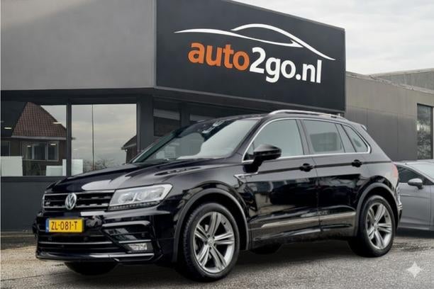 Volkswagen Tiguan 1.5 TSI AUT7 2X R-LINE DESIGNO-INT NAVI DI, Auto's, Gebruikt, Euro 6, 150 pk, Alcantara