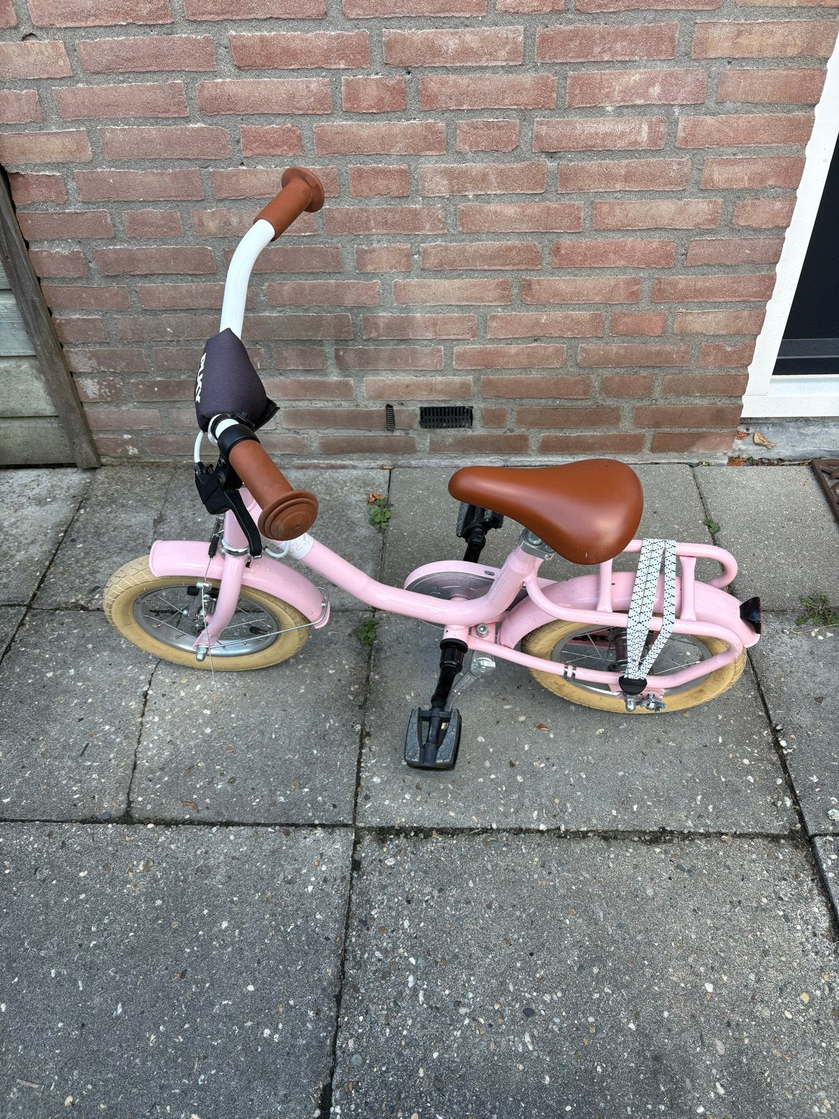 Puky kinderfiets 12 inch roze met bruin zadel en handvatten, Ophalen, Gebruikt, Velgrem, Minder dan 16 inch