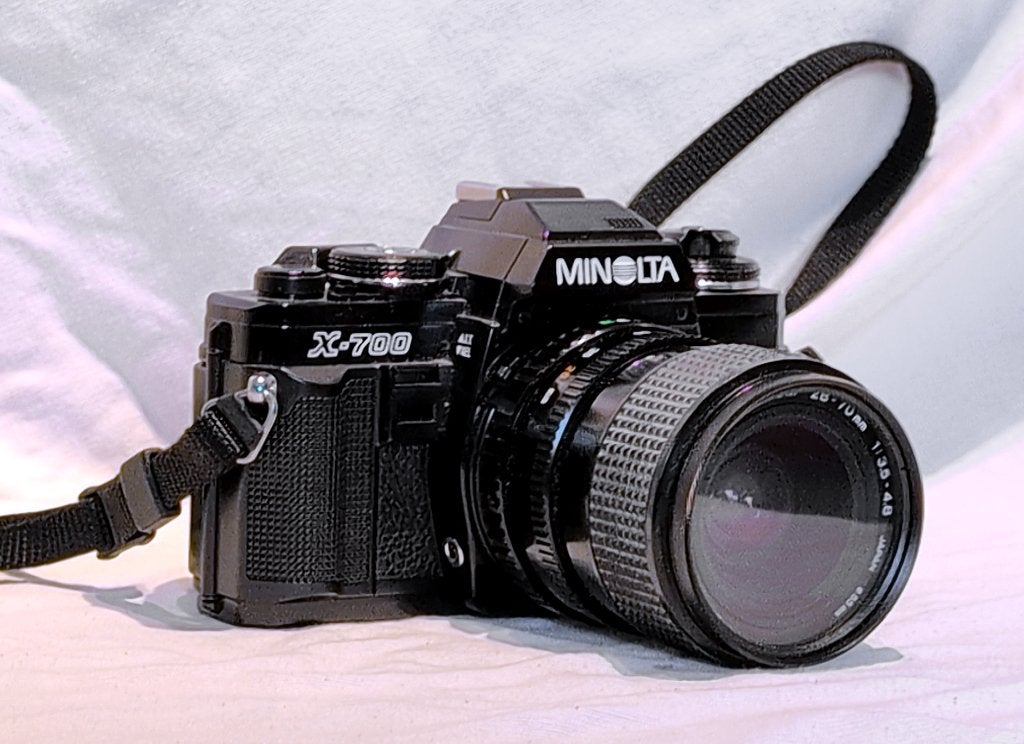 Minolta X700, XG9 en 5 objectieven en makro extender, Ophalen of Verzenden, Gebruikt, Spiegelreflex, Minolta