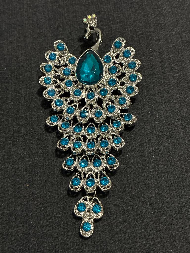 Pauwenbroche met blauwe steentjes, Overige materialen, Gebruikt, Ophalen of Verzenden, Zilver