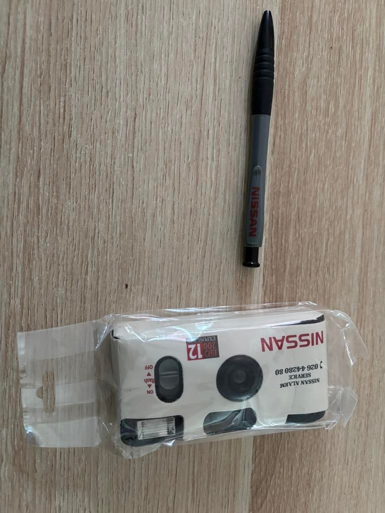 Nissan camera & onderhoudsboek met toebehoren, Ophalen of Verzenden, Auto's