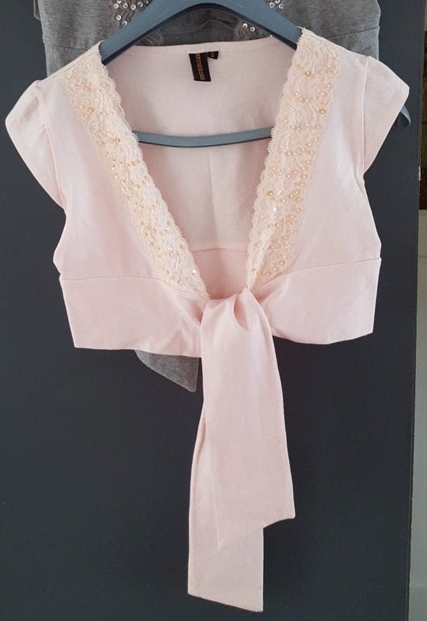 Wonder Woman bolero met kant en pailletjes mt. S, Wonder Woman, Verzenden, Zo goed als nieuw, Roze