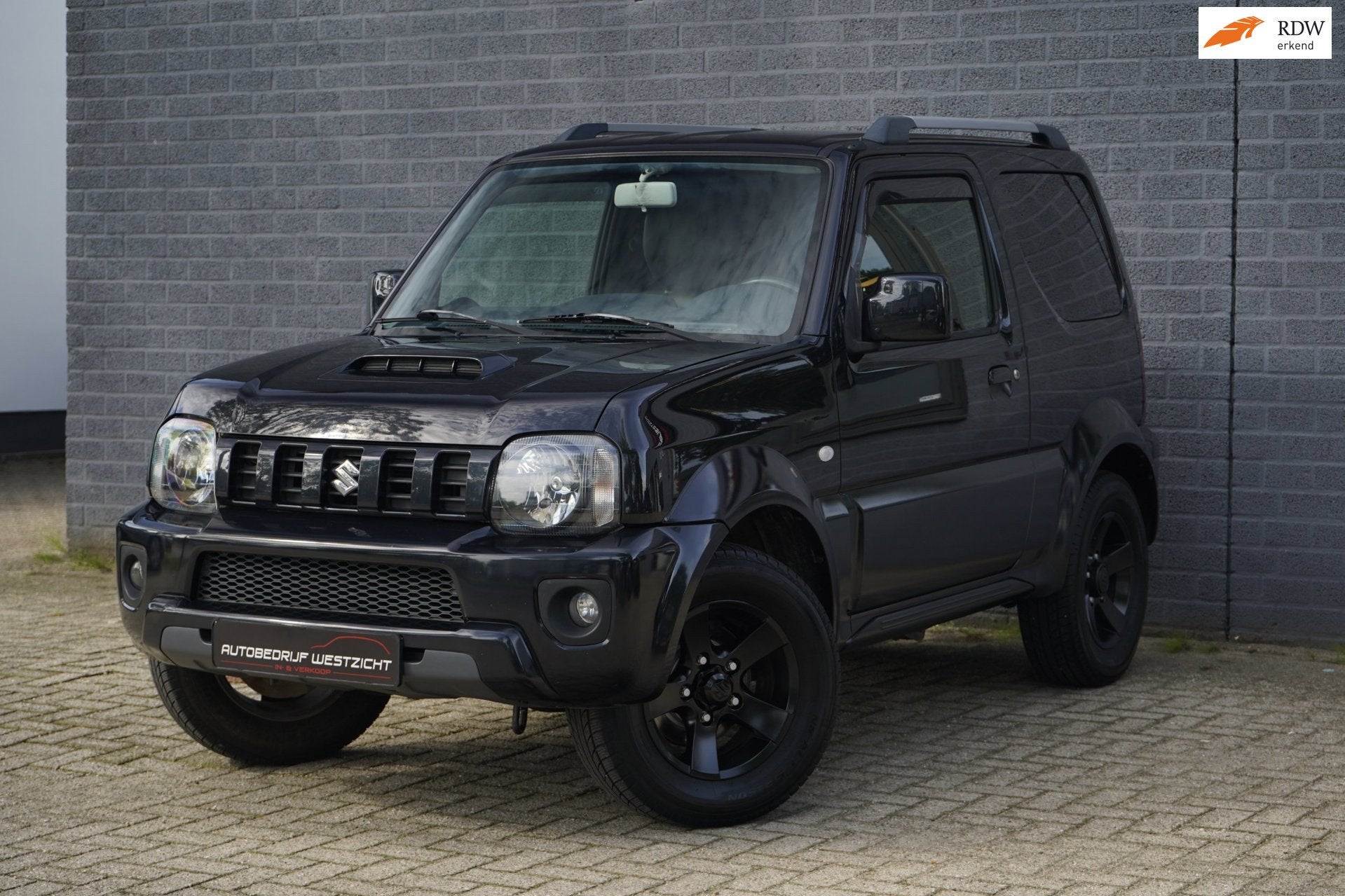 Suzuki Jimny 1.3 Exclusive 4WD, Leder, Airco, Trekhaak, Auto's, 86 pk, Zwart, 4 stoelen, Zwart