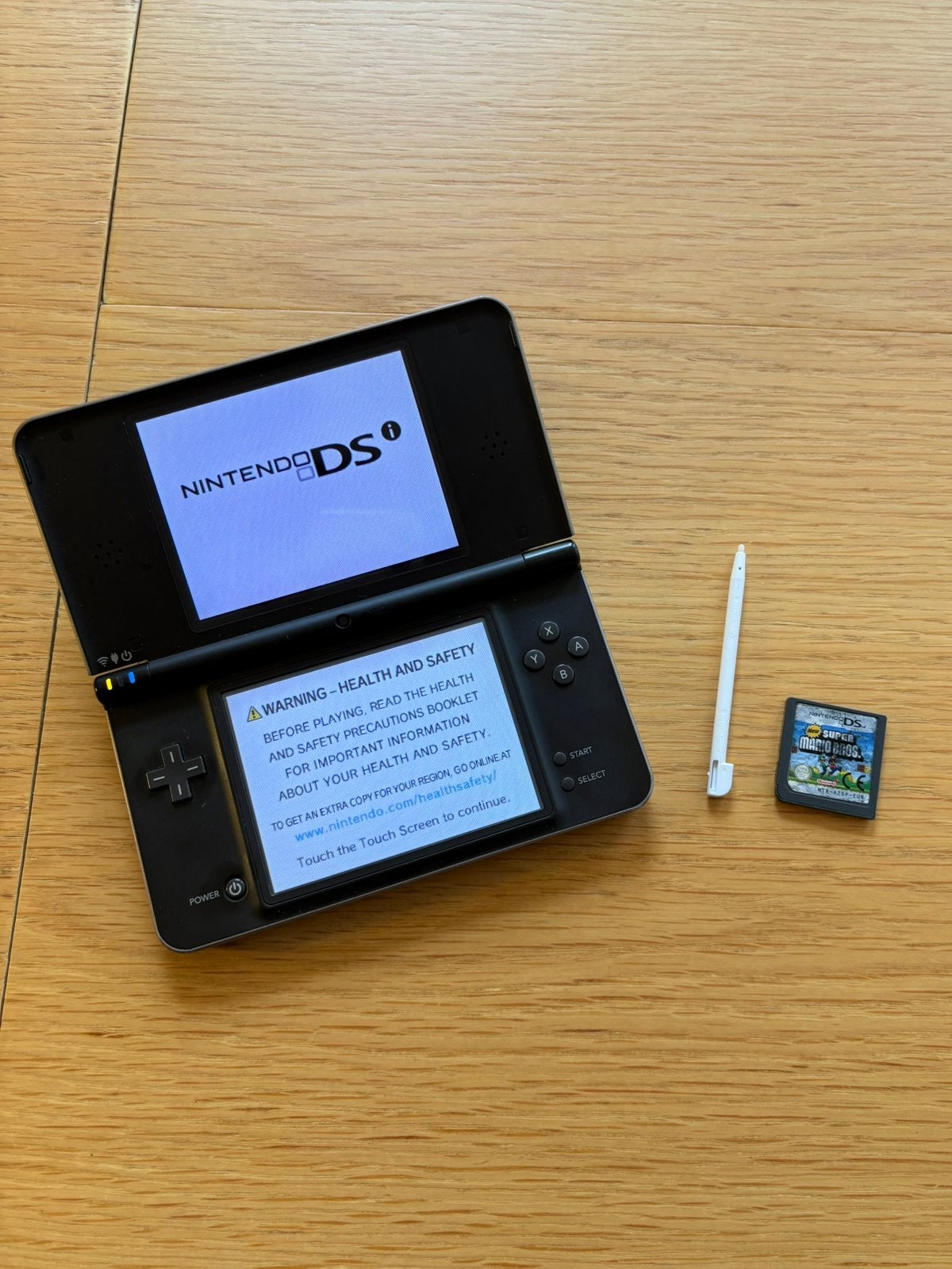 Nintendo DSi XL + New Super Mario Bros., Dsi XL, Met games, Zwart, Ophalen of Verzenden