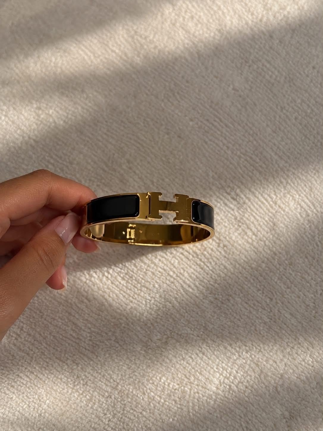 Hermès Clic H Armband Zwart/Goud, Sieraden, Tassen en Uiterlijk, Ophalen of Verzenden, Nieuw, Zwart, Overige materialen