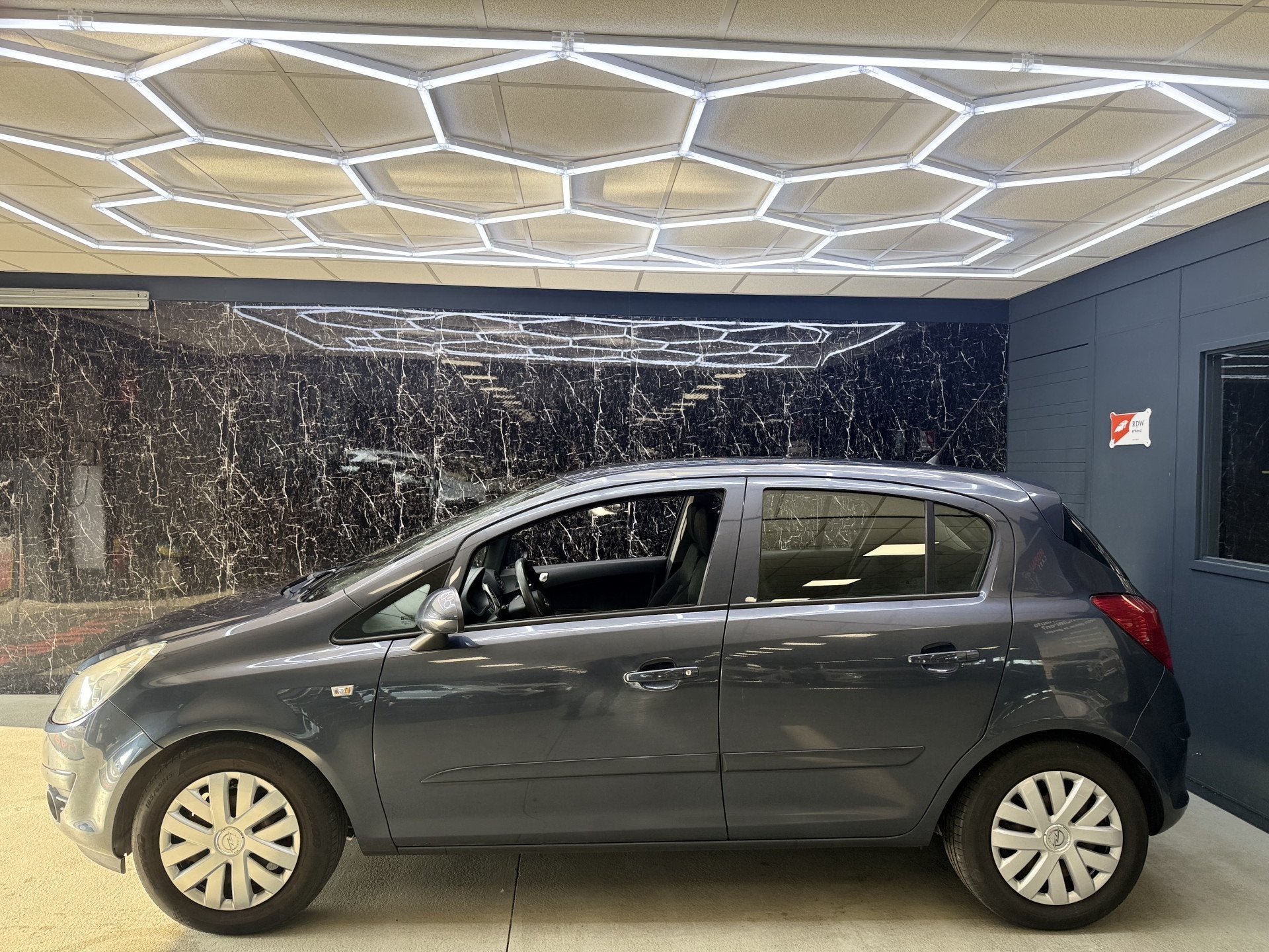 Opel Corsa 1.4-16V Enjoy (bj 2008), Auto's, Voorwielaandrijving, Gebruikt, Zwart, 4 cilinders