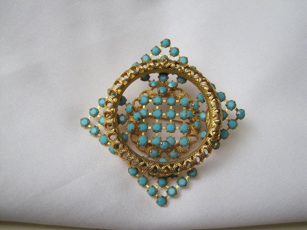 Broche verguld met turquoise glassteentjes., Verzenden, Zo goed als nieuw, Blauw, Overige materialen
