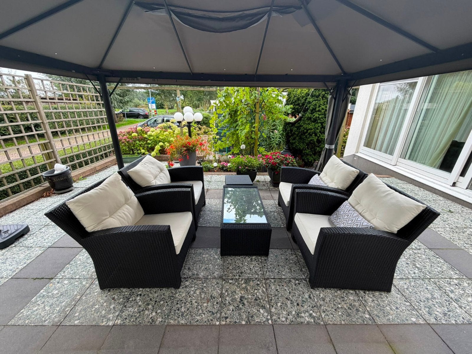 Lounge tuinset, 4 grote stoelen zwart wicker, tafel,hocker, Tuin en Terras, Ophalen, 4 zitplaatsen, Gebruikt, Bijzettafel