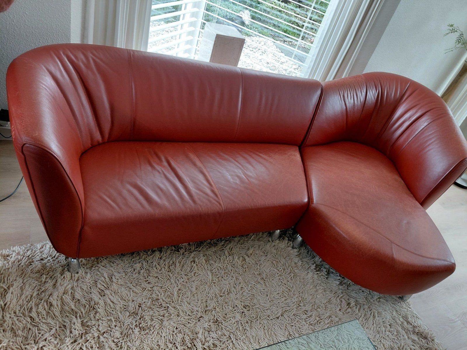 Lounge bank Leolux Pupilla, kleur terra rood-oranje., Ophalen, 250 tot 300 cm, Gebruikt, 125 tot 150 cm