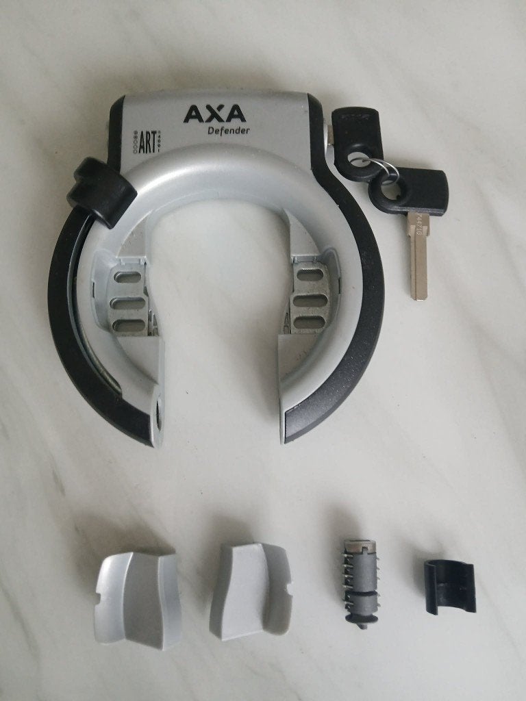 Nieuw AXA ringslot Defender zilver + extra cilinder, Ophalen of Verzenden, Nieuw, Ringslot