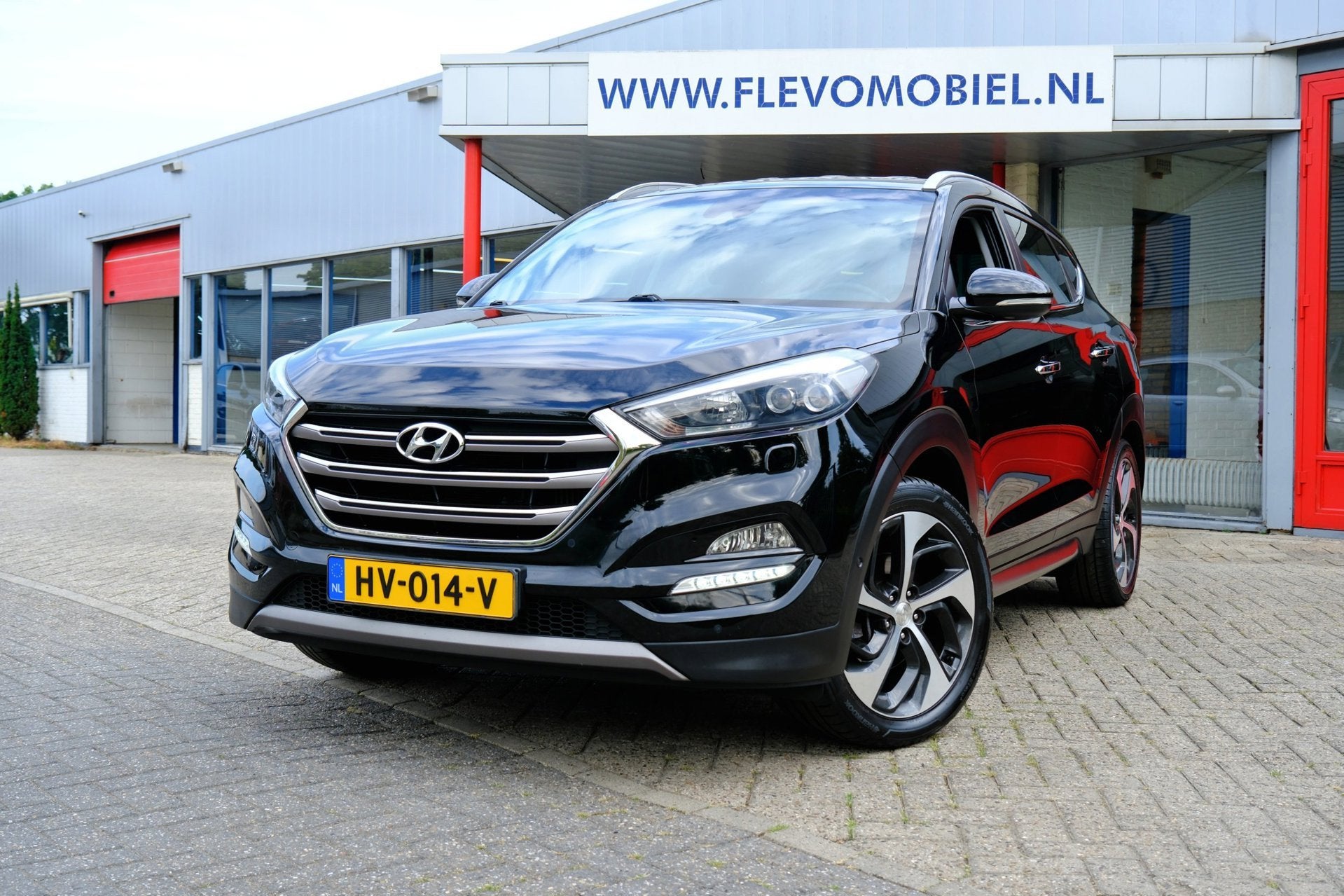 Hyundai Tucson 1.6 T-GDi Premium 4WD Aut. Leder|Navi|Cam|LMV, Auto's, Gebruikt, 4 cilinders, Zwart, Bedrijf