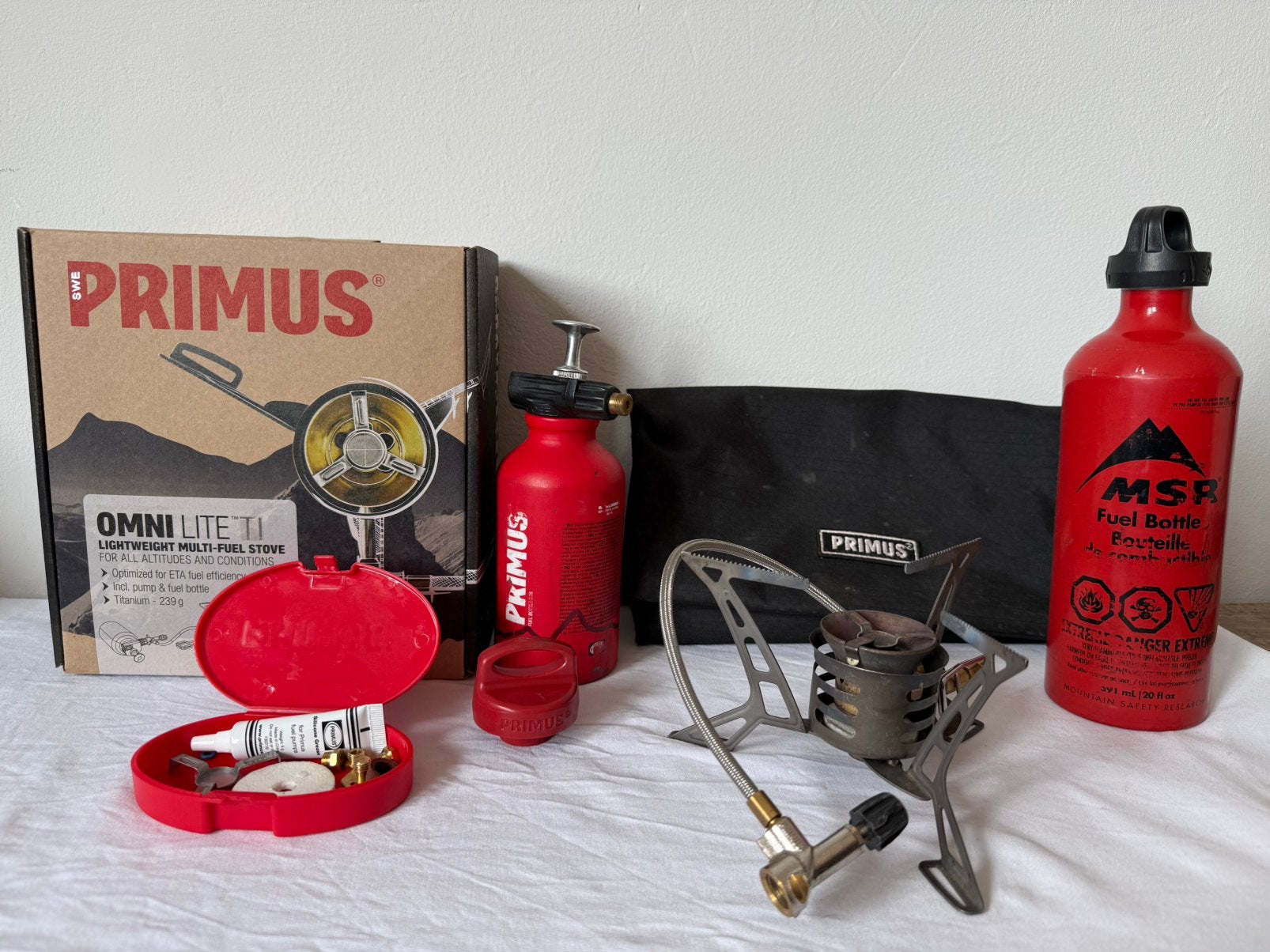 Primus OmniLite Ti multifuelbrander + MSR brandstoffles, Ophalen of Verzenden, Gebruikt