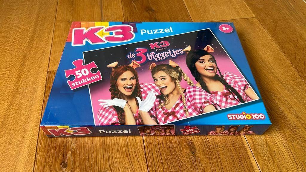 K3 puzzel 50 stuks de 3 biggetjes - nieuw in verpakking., Ophalen of Verzenden, Meer dan 50 stukjes, Nieuw, 4 tot 6 jaar