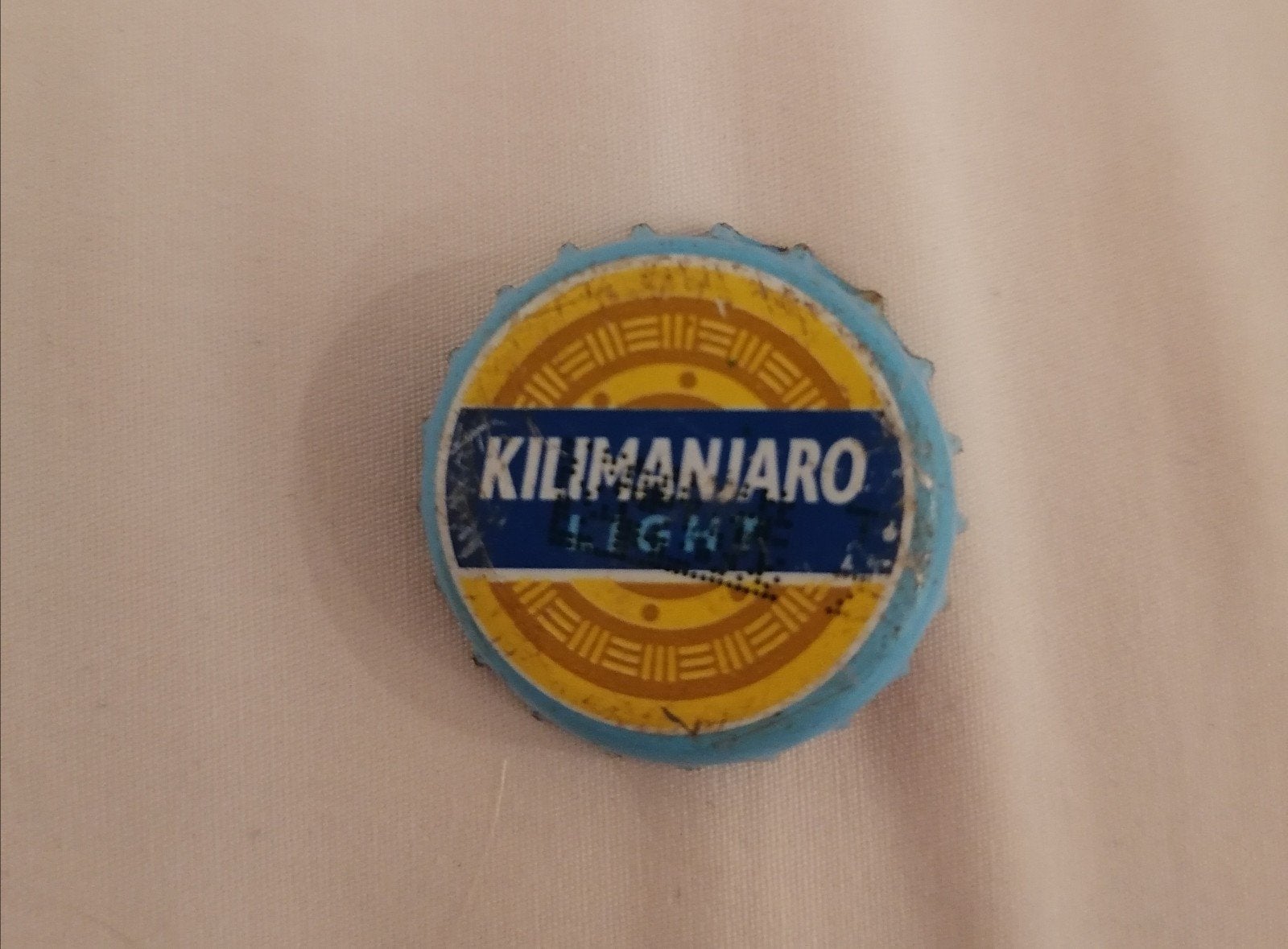 Kroonkurk van een Kilimanjaro Light bier uit Tanzania, Verzamelen, Ophalen of Verzenden, Zo goed als nieuw, Flesje(s), Overige merken