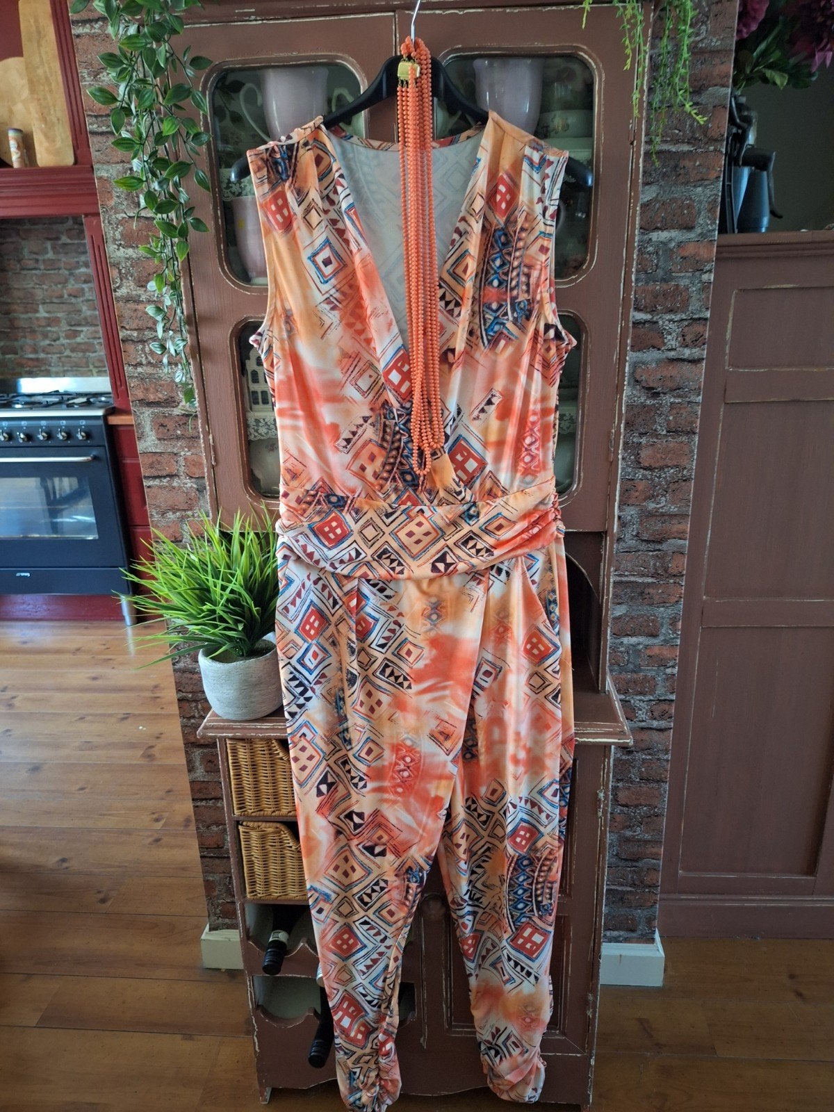 Jumpsuit oranje kreukvrij travelstof  maat m l 38 40 42, Kleding | Dames, Jumpsuits, Ophalen of Verzenden, Zo goed als nieuw, Maat 38/40 (M)