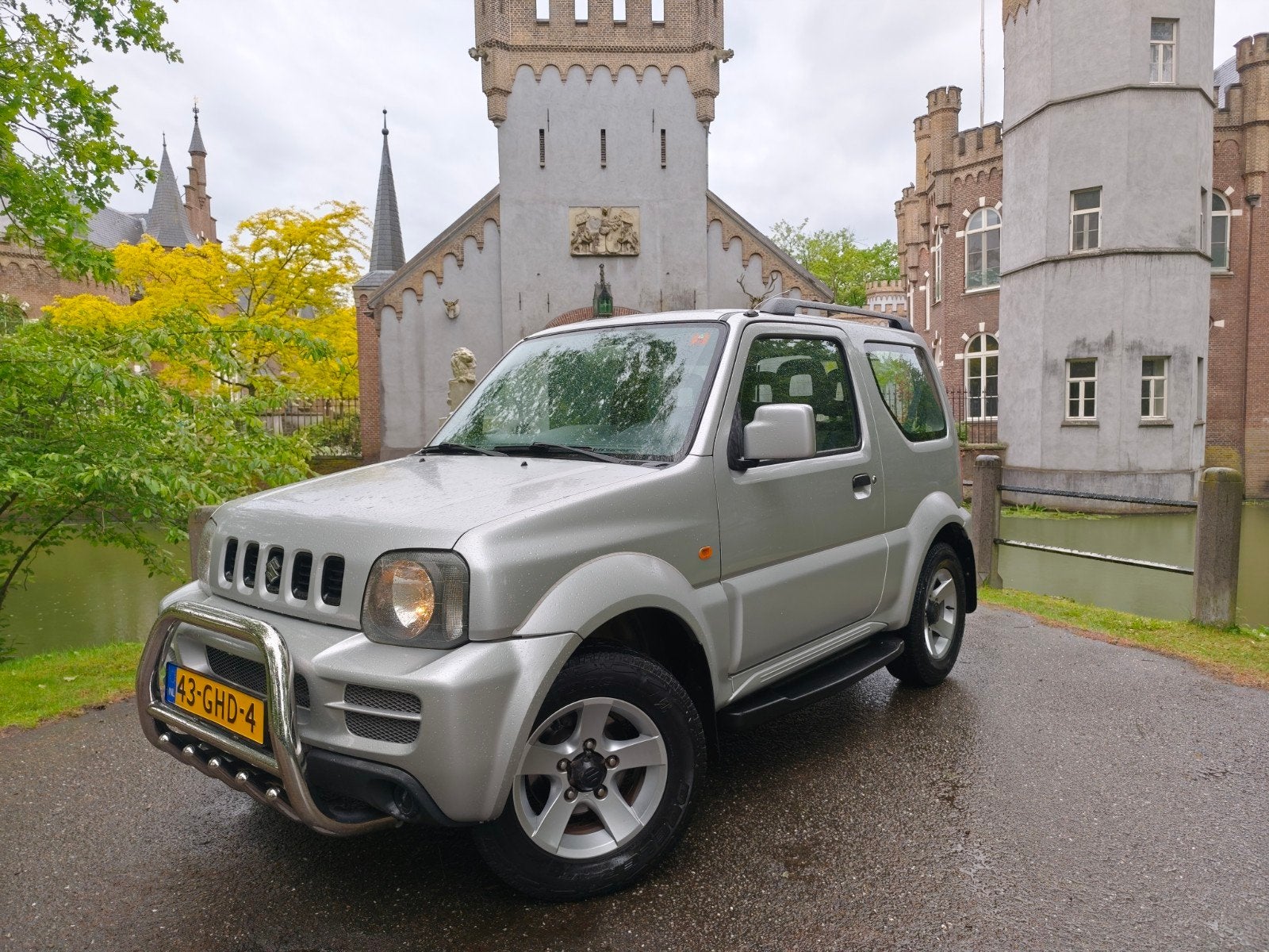 Suzuki Jimny 1.3 4WD AUTOMAAT / trekhaak / zeer mooi / NAP !, Auto's, Suzuki, Stof, 40 €/maand, Zwart, 4 stoelen