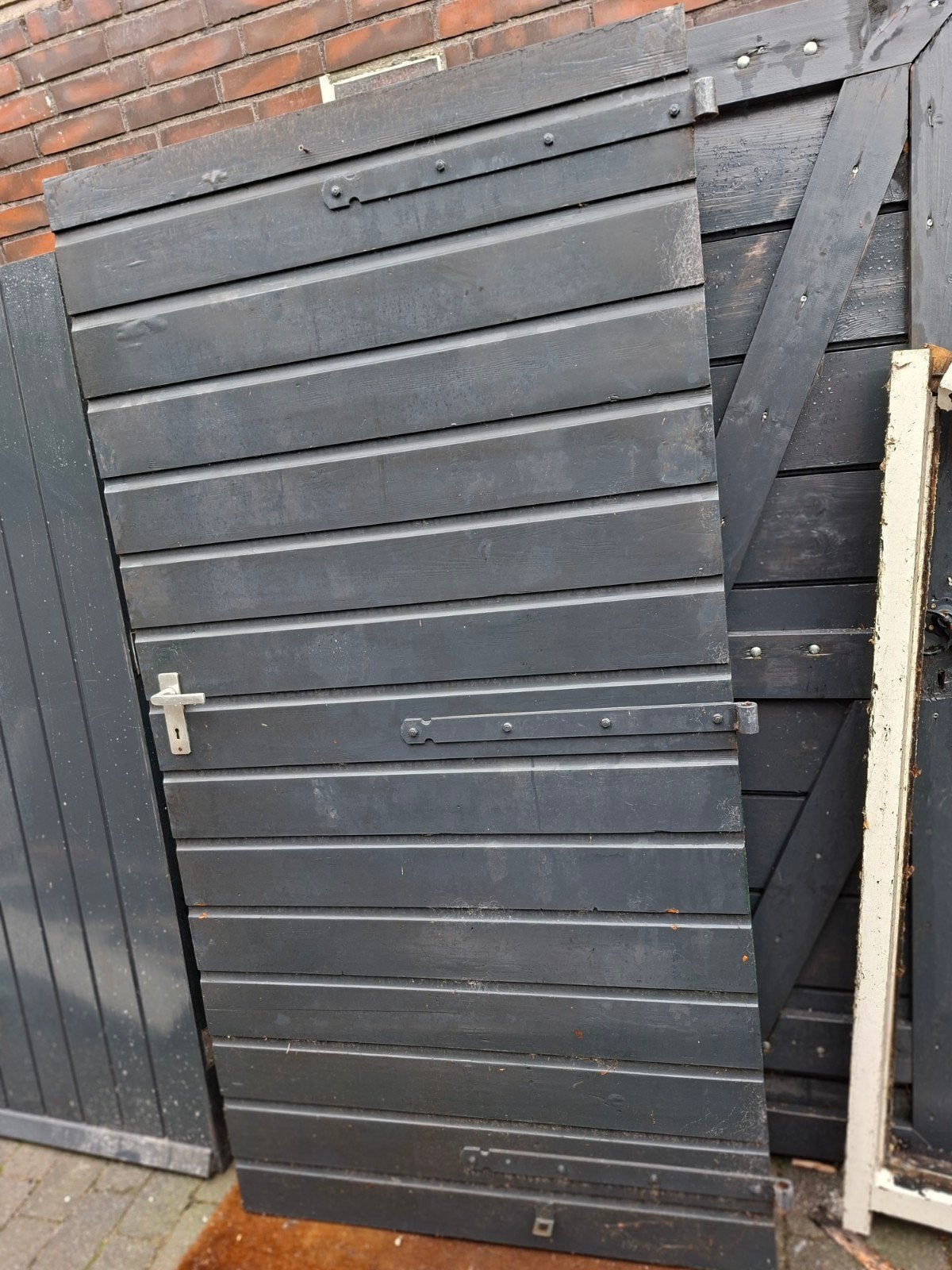 Houten dubbele garagedeur., Doe-het-zelf en Verbouw, Deuren en Horren, Gebruikt, Garagedeur, Ophalen of Verzenden, 120 cm of meer