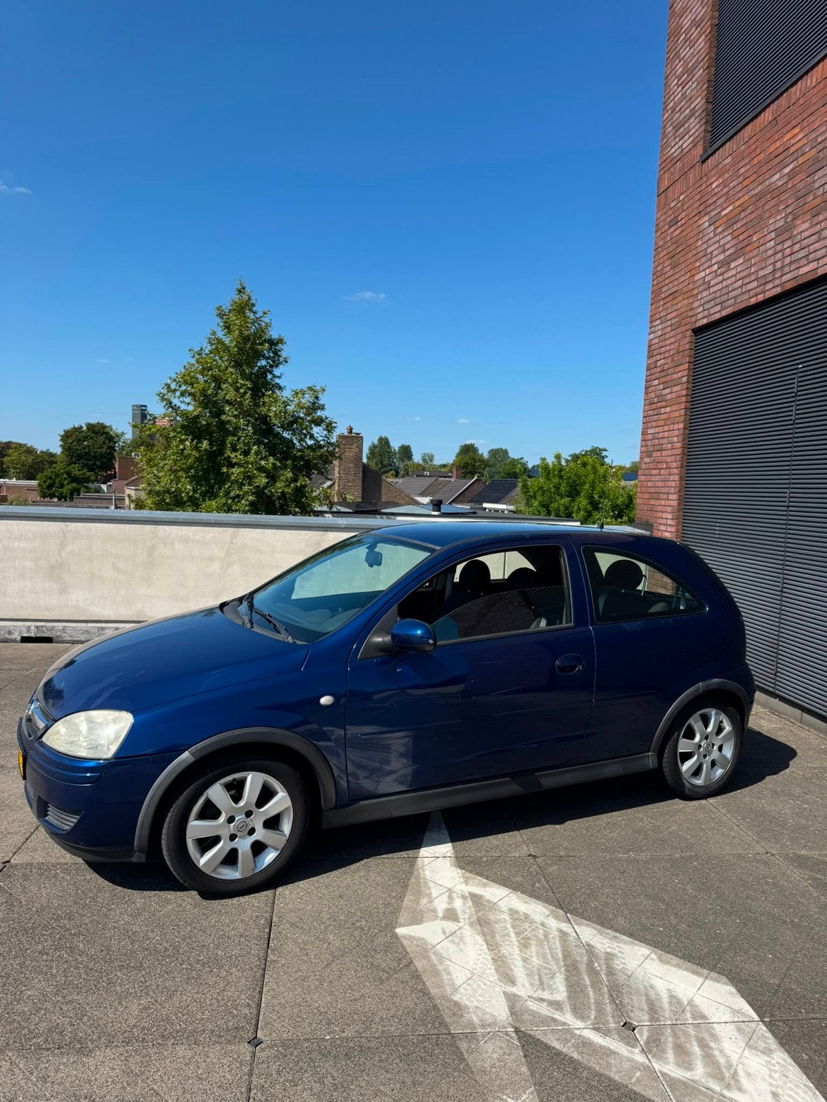 Opel Corsa 1.2 16V Twinport 3D 2006 Blauw, Auto's, Voorwielaandrijving, Zwart, 4 cilinders, Blauw