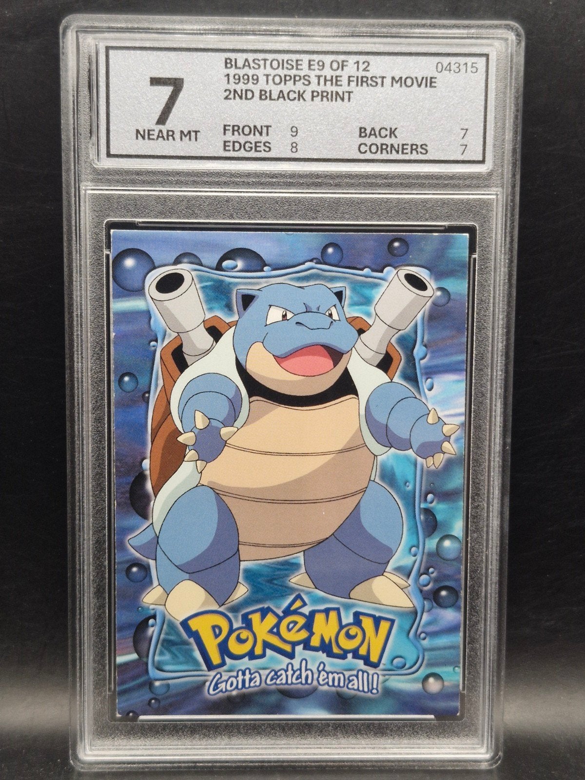Blastoise 1999 topps the first movie #e9 woetoe grading 7, Verzenden, Zo goed als nieuw, Losse kaart