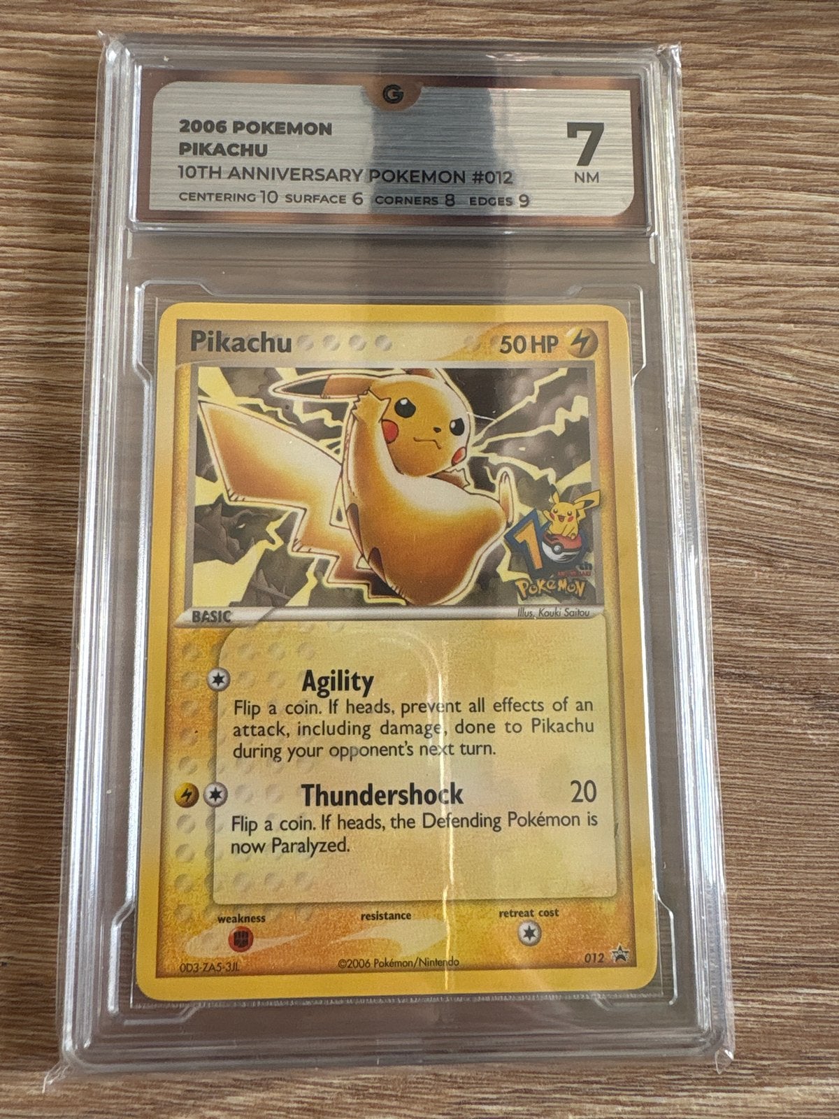 2006 Pikachu 10th Anniversary Pokémon #012 PSA 7 NM, Ophalen of Verzenden, Zo goed als nieuw, Losse kaart