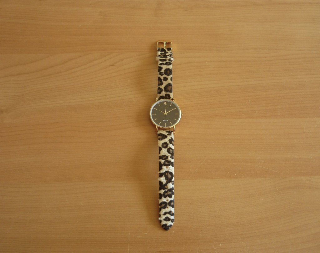 Goudkleurig zwart horloge met jaguarmotief horlogebandje, Ophalen of Verzenden, Zo goed als nieuw, Overige merken