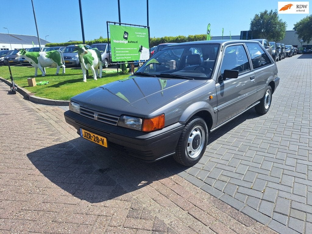 Nissan Sunny 1.3 L / AUTOMAAT / Uitzonderlijk netjes / NIEUW, Auto's, Nissan, Voorwielaandrijving, Metallic lak, Gebruikt, 60 pk