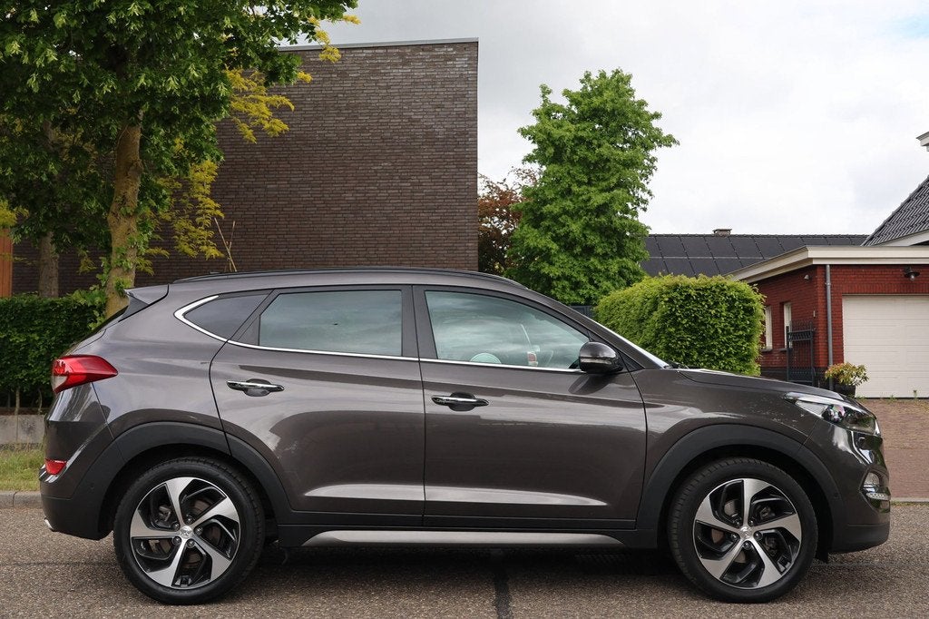 Hyundai Tucson 1.6 T-GDi Premium 4WD | AUTOMAAT | PANO | NAV, Auto's, Hyundai, Gebruikt, 4 cilinders, Bruin, Bedrijf