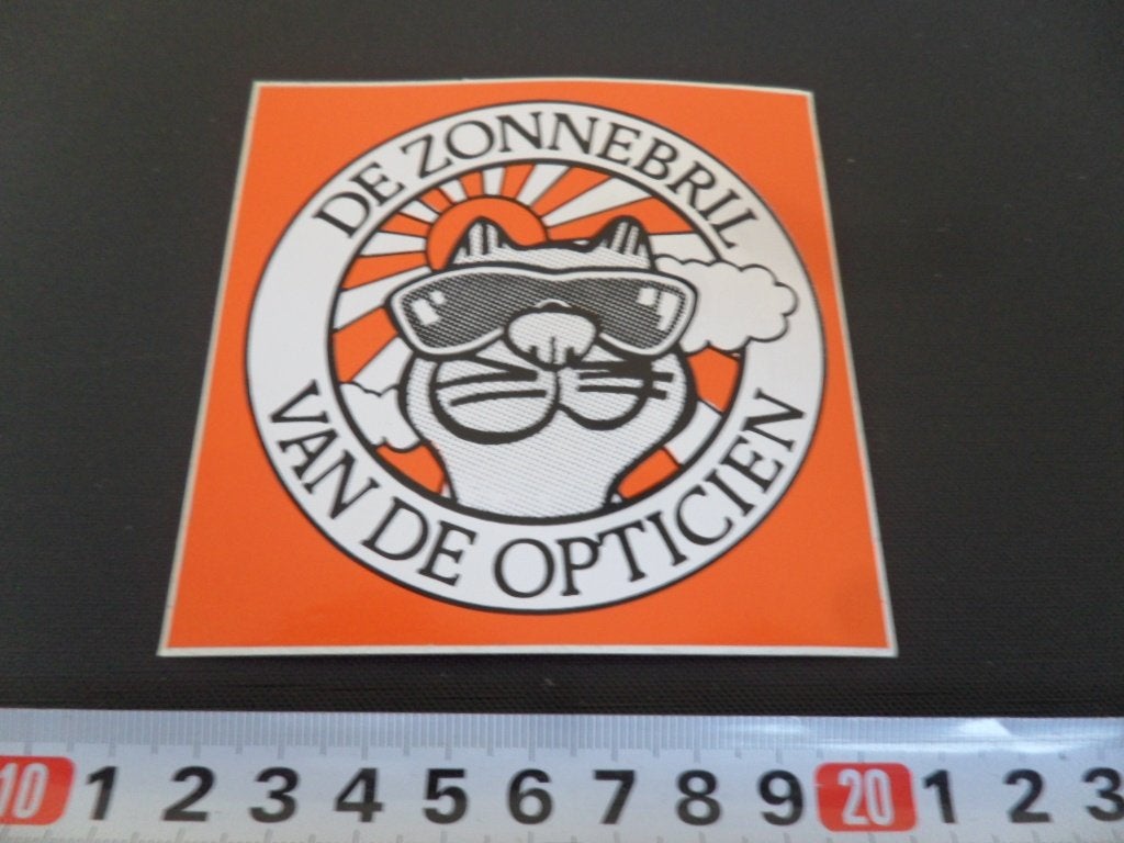 sticker De zonnebril van de opticien, Ophalen, Zo goed als nieuw