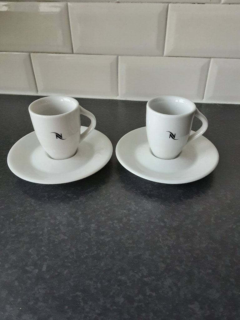 NESPRESSO special club 1999 kopjes met schoteltjes 2 st., Overige materialen, Overige merken, Ophalen of Verzenden, Zo goed als nieuw