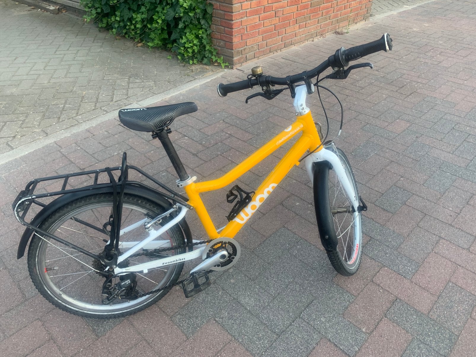 Goed onderhouden WOOM 4 (20 inch) kinderfiets te koop, Ophalen, Gebruikt, Velgrem, 16 tot 20 inch