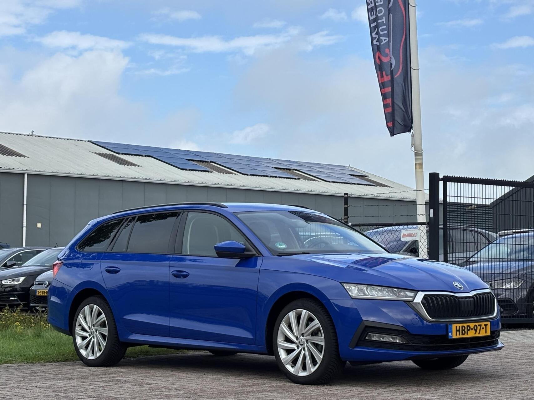 Skoda Octavia Combi 1.4 TSI iV PHEV Business Edition trekhaa, Auto's, Gebruikt, Euro 6, Blauw, Automatische klimaatregeling