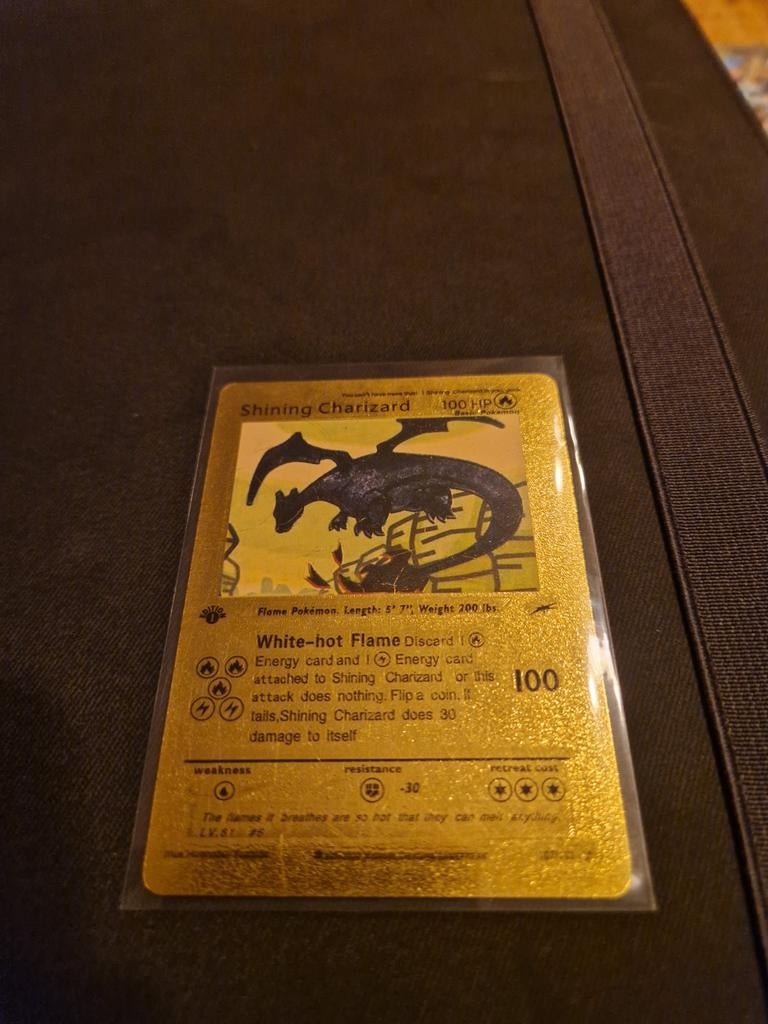 Shining Charizard Gold Plated Pokémon Kaart, Ophalen of Verzenden, Zo goed als nieuw, Losse kaart, Foil