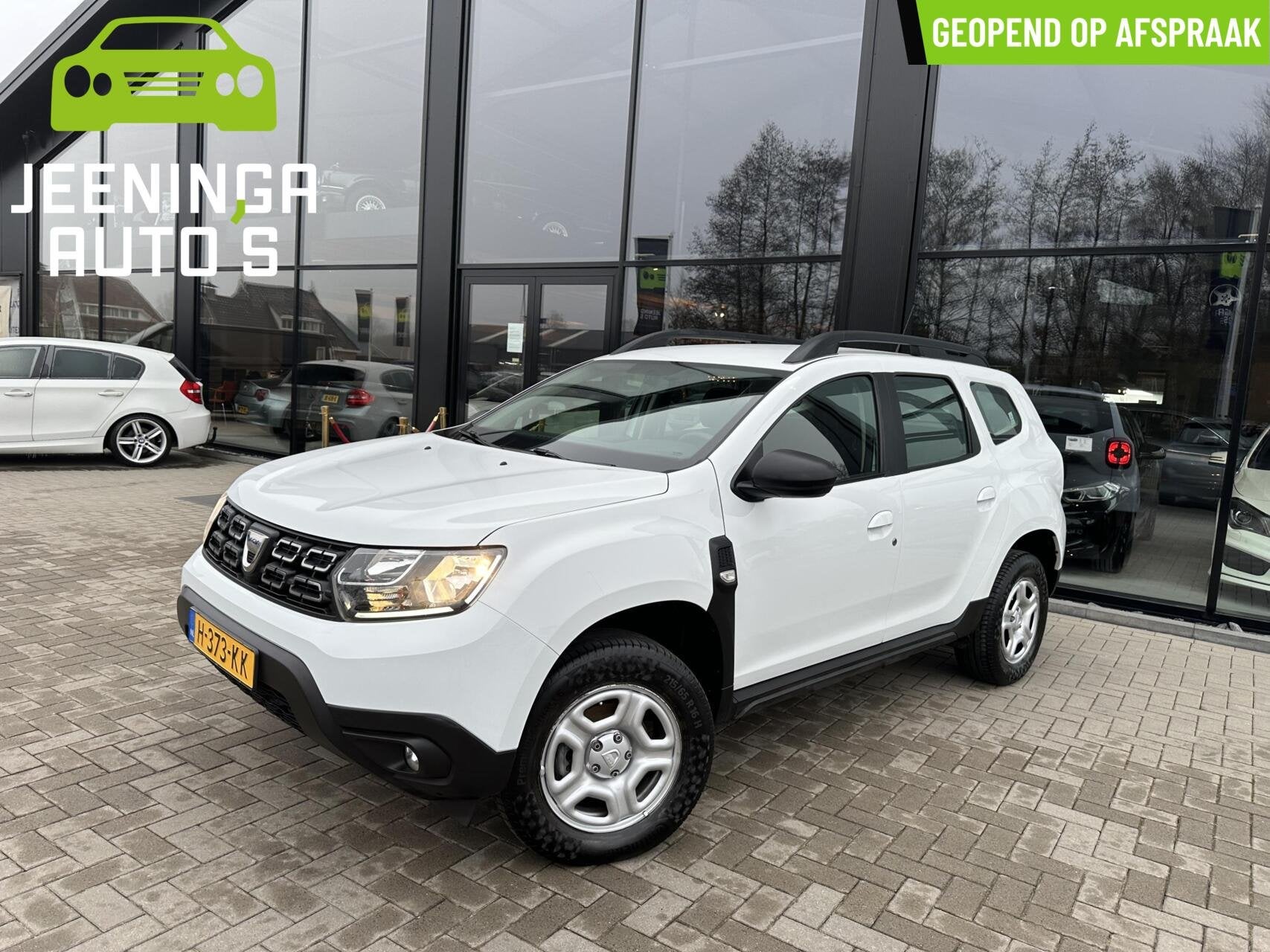 Dacia Duster TCe 100 Comfort|Airco|Cruise, Gebruikt, 4 cilinders, Duster, Wit