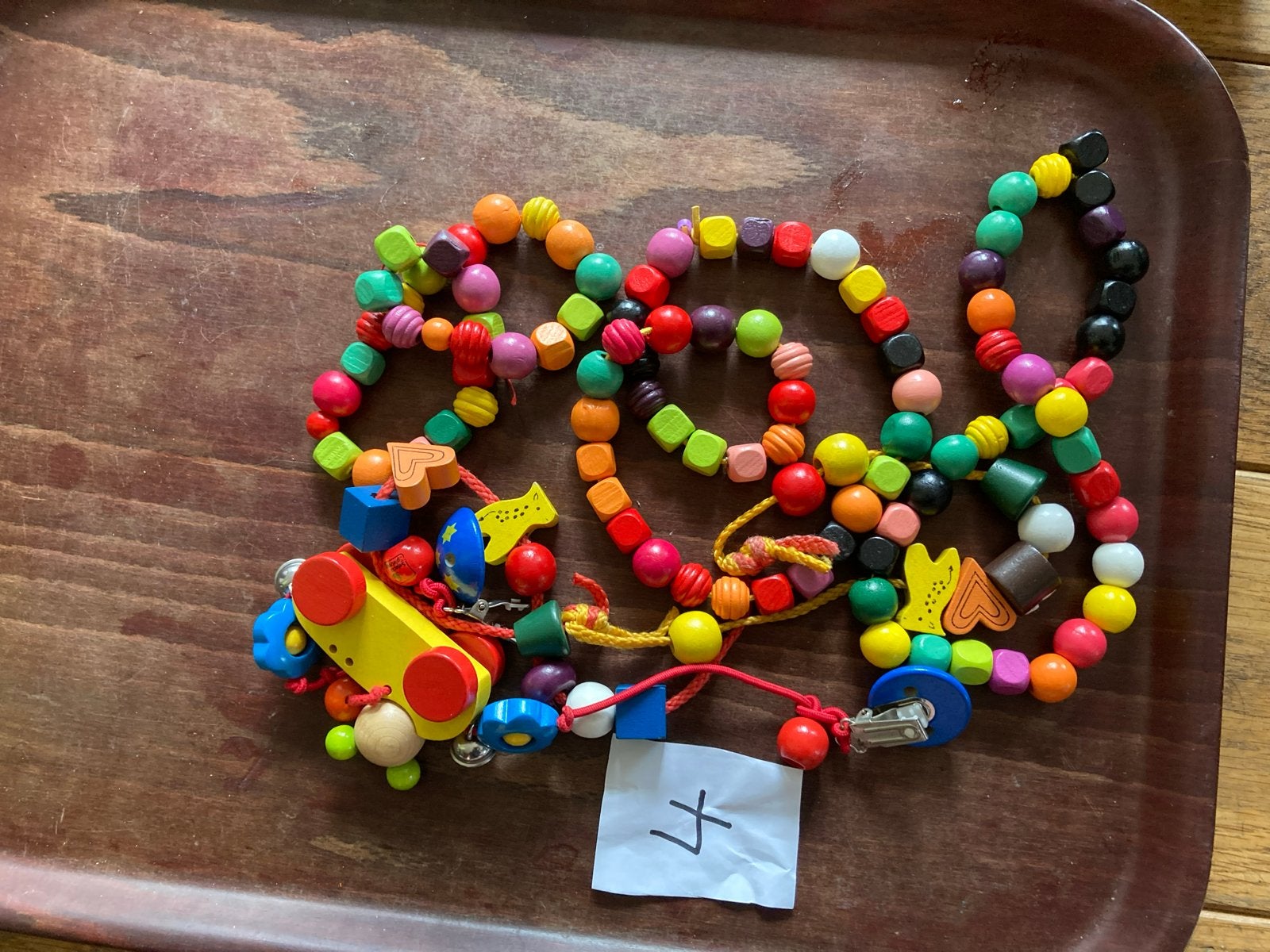 Houten kralenketting met auto en belletjes, Ophalen of Verzenden, Gebruikt, Overige typen