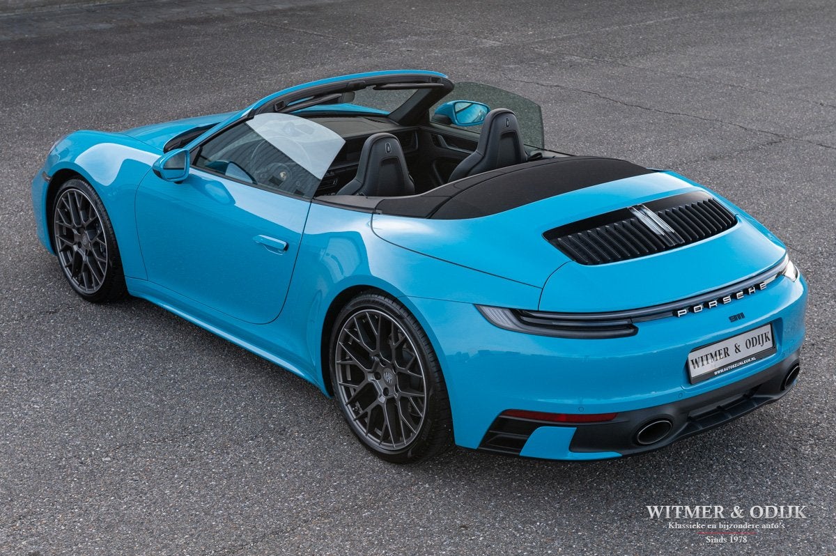 Porsche 911 Cabrio 3.0 Carrera Miami Blue (bj 2020), Automaat, Dealer onderhouden, Achterwielaandrijving, Gebruikt