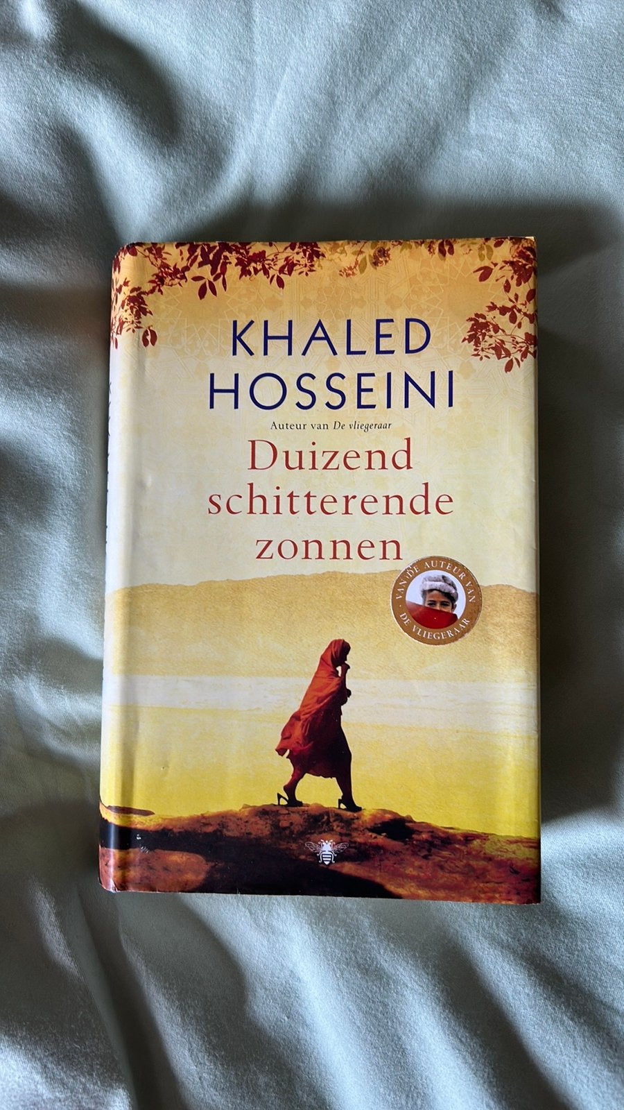 Duizend schitterende zonnen, Ophalen of Verzenden, Zo goed als nieuw