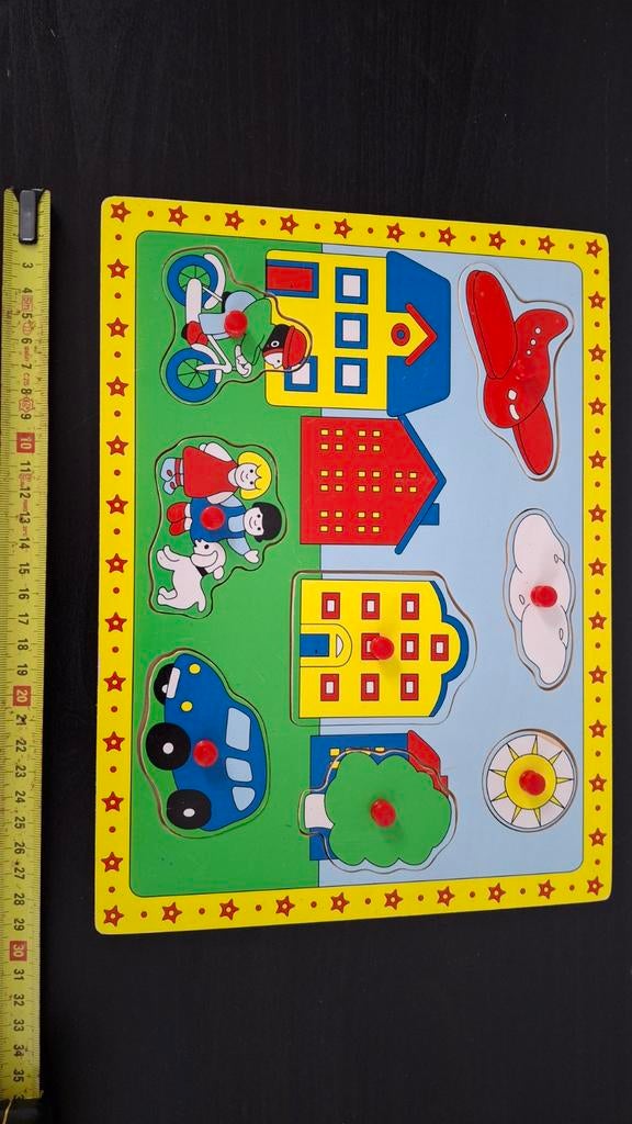 Houten insteekpuzzel met dorpstafereel, Ophalen