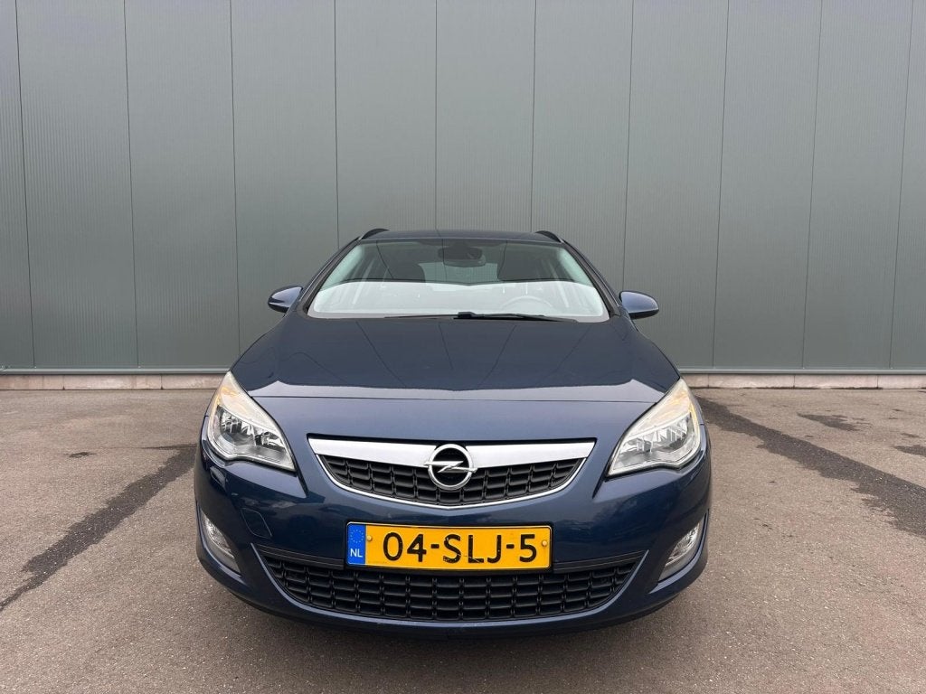 Opel Astra Sports Tourer 1.4 Turbo Edition ONDERHOUDSBOEKJE, Auto's, Euro 5, 15 km/l, 4 cilinders, Blauw