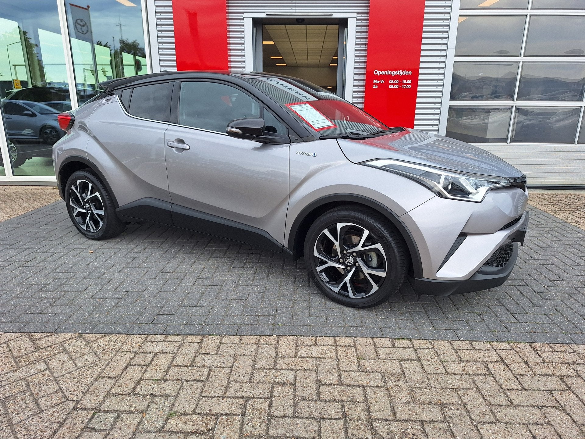 Toyota C-HR 1.8 Hybrid Bi-Tone (bj 2019, automaat), Auto's, 12 maanden, Stof, Euro 6, 4 cilinders