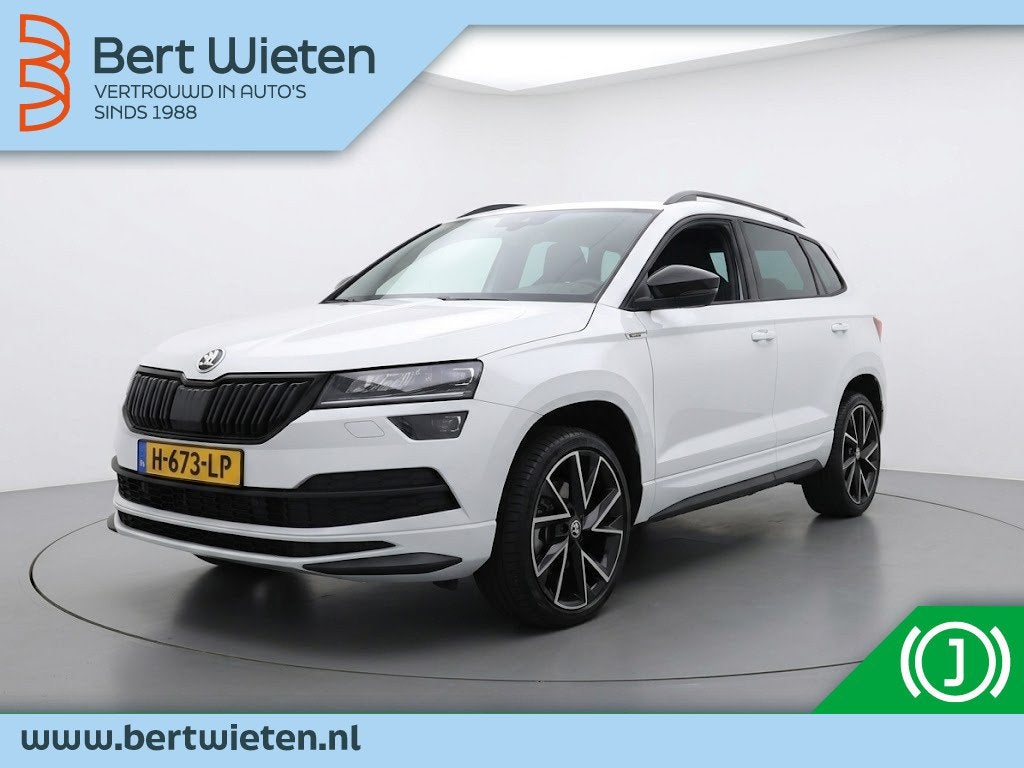 Skoda Karoq 1.5 TSI ACT Sportline Business | Geen import | A, Auto's, Dealer onderhouden, 4 cilinders, 150 pk, Leder en Stof