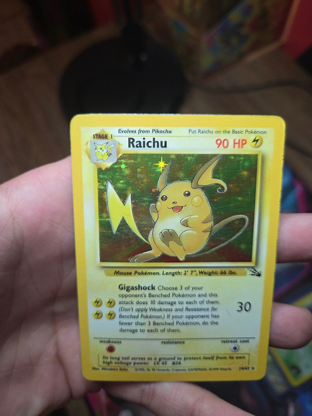 Raichu 14/62 Holo Fossil 1999 Wotc era Vintage nr2, Ophalen, Zo goed als nieuw, Losse kaart, Foil