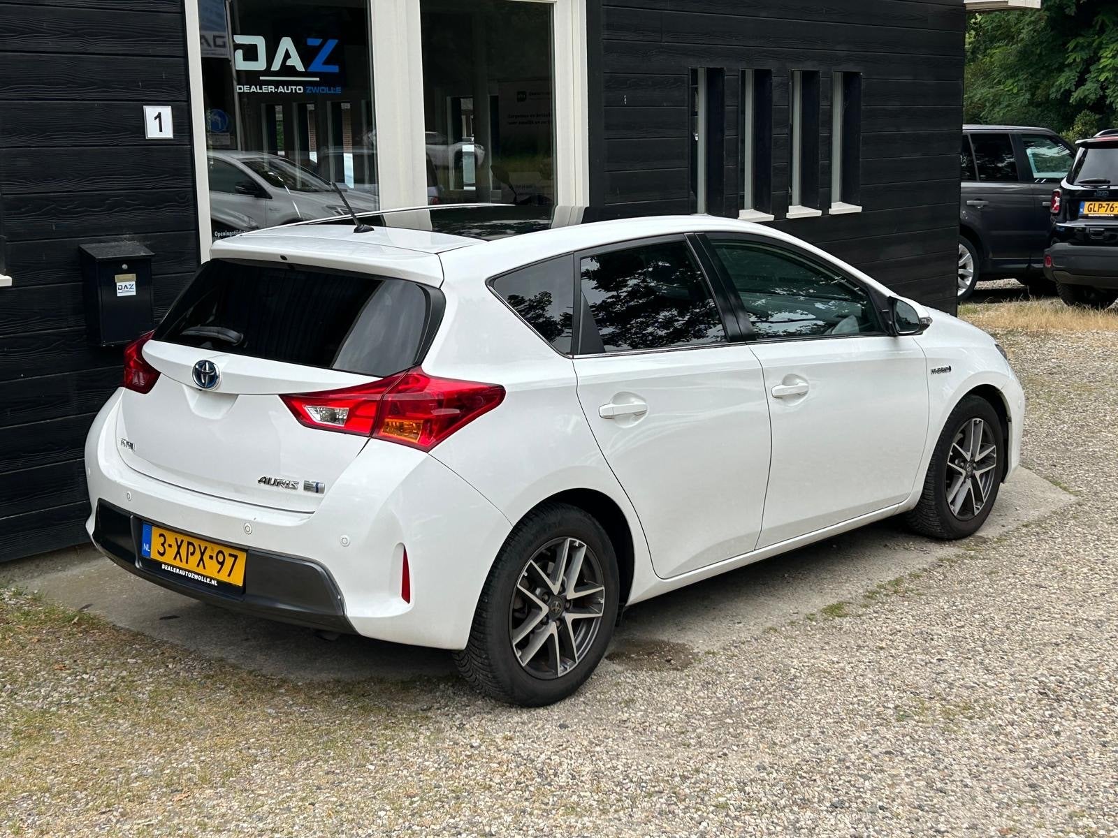 Toyota Auris 1.8 Hybrid Lease Aut/Ecc/Navi/Pano (bj 2014), Auto's, Toyota, Euro 5, Stof, Gebruikt, 4 cilinders