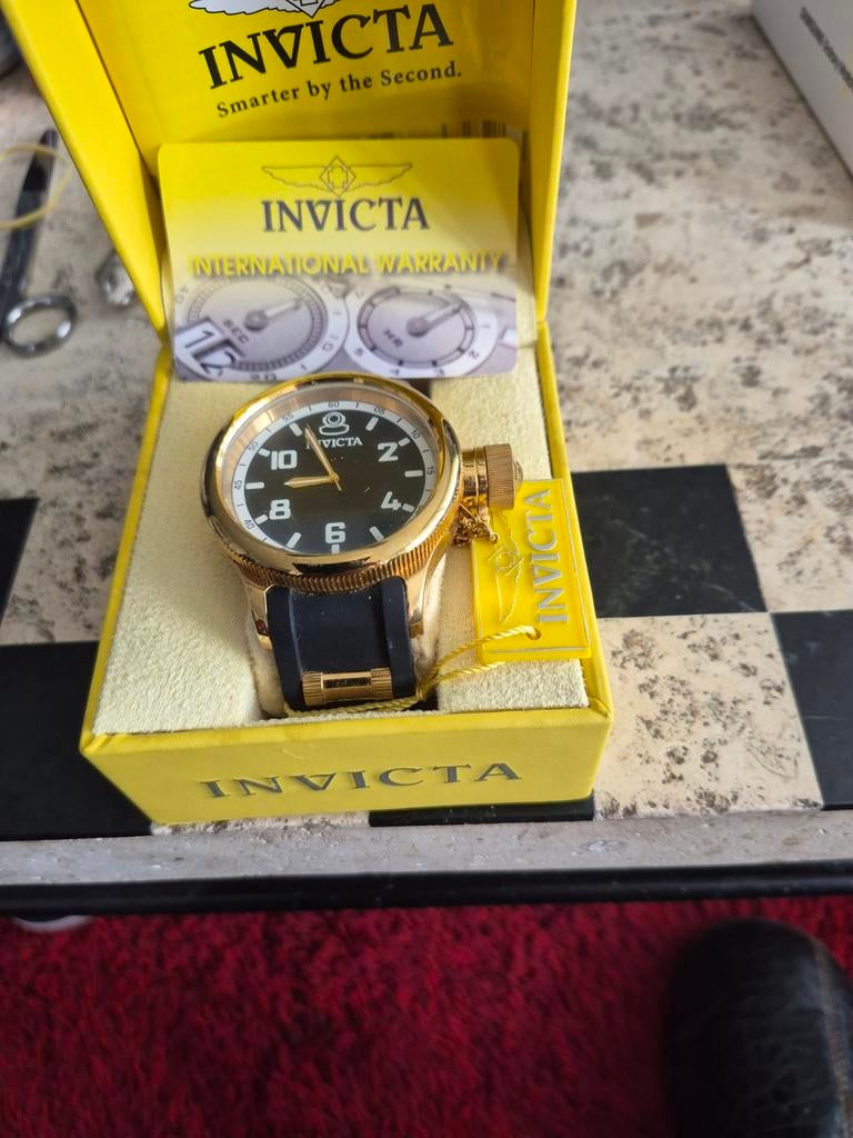 Invicta herenhorloge goudkleurig met zwart bandje, Overige merken, Staal, Polshorloge, Overige materialen