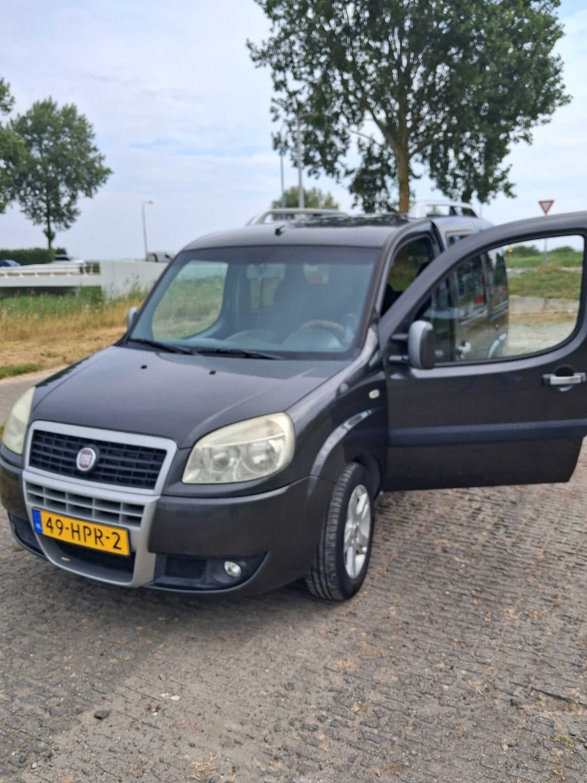 Fiat Doblo 1.4 2009 Grijs 141600km nap✅, Voorwielaandrijving, Stof, Doblo, Handgeschakeld