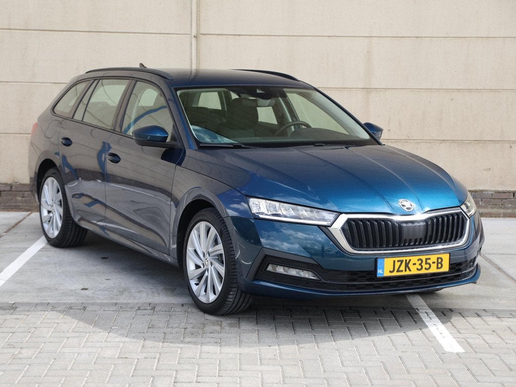 Skoda Octavia Combi 1.4 TSI iV PHEV Business Edition 204 PK, Auto's, Stof, Gebruikt, Euro 6, Blauw