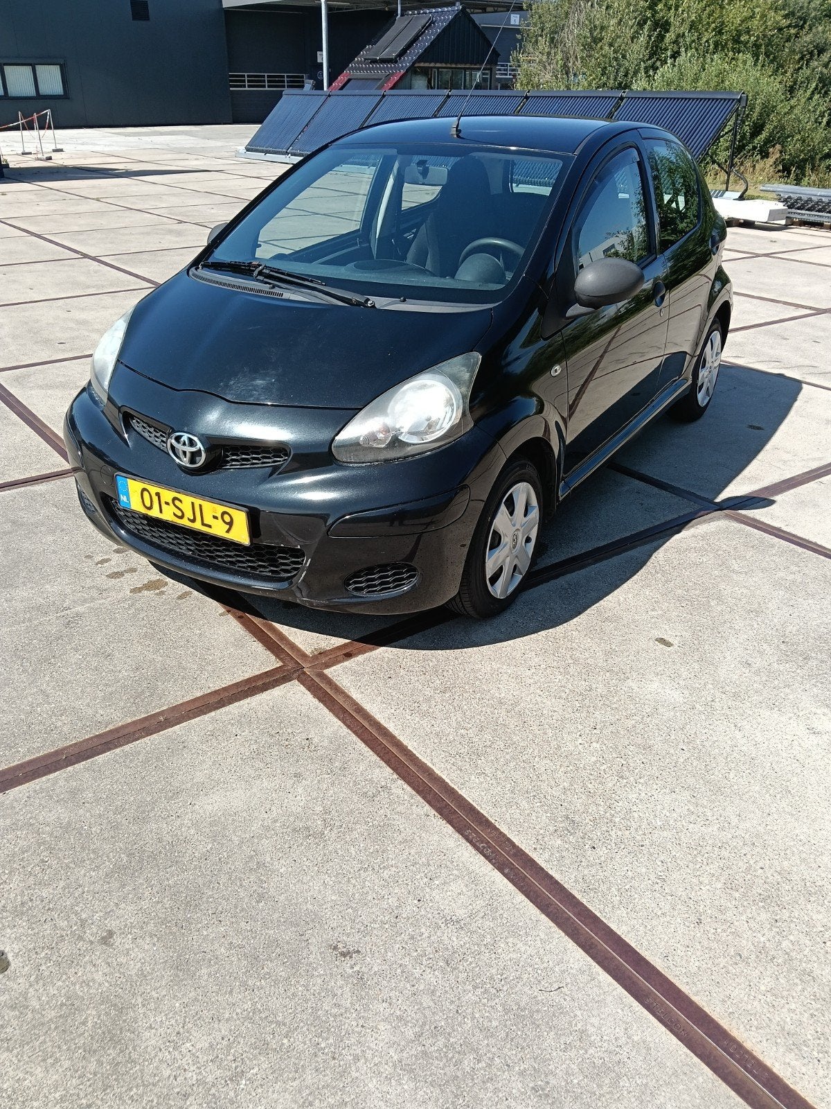 Toyota Aygo 1.0 12V Vvt-i 5DRS 2011 Zwart, Auto's, Toyota, Voorwielaandrijving, Stof, Zwart, 4 cilinders