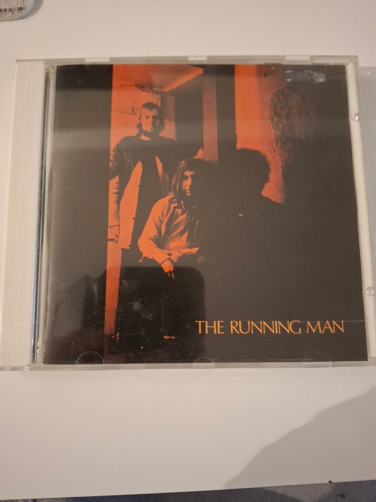 The running man, Ophalen of Verzenden, Zo goed als nieuw, Pop, Inclusief boekje